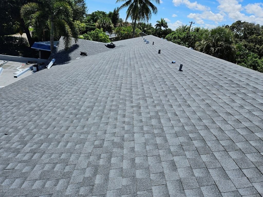 Storm damage to a Florida roof documented by Expert Roofing Services